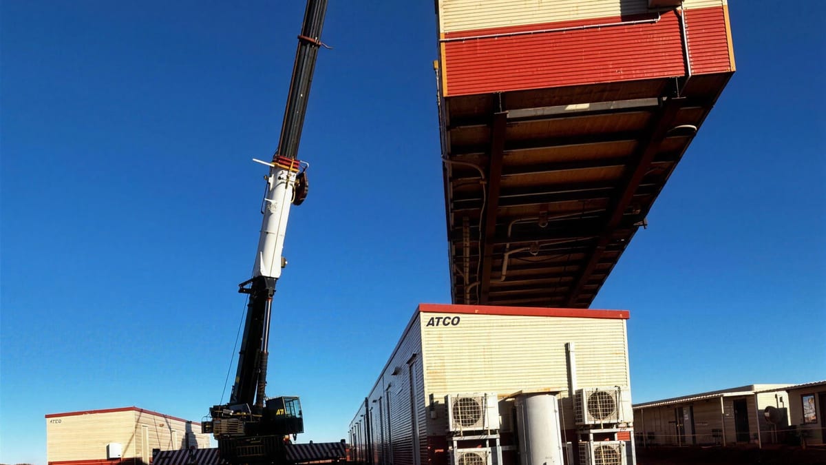 Transportable accommodation building being craned into position at a mining camp
